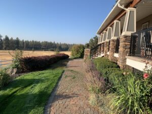 Beautifully landscaped walkways surround the main house.