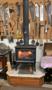 The wood stove in the workshop means year round use of dad's creative space.